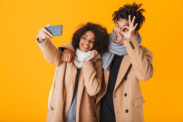 Happy african couple wearing winter clothes