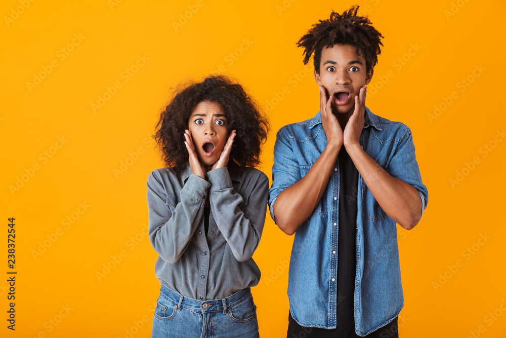 Canvas Prints Shocked young african couple standing