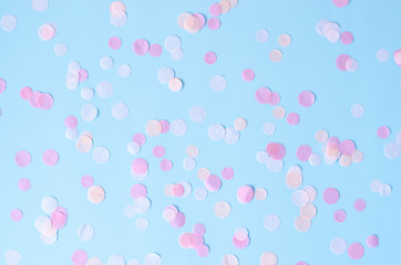 Background with round confetti on a blue background.