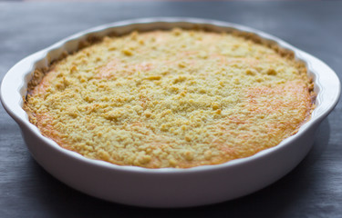 freshly baked cottage cheese cake on dark background