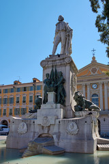 Fototapeta na wymiar France. Nice. Piazza Garibaldi. Monument of Garribaldi. Against the background of the Chapel of the Holy Sepulcher