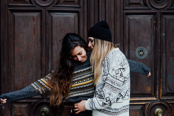 Couple women enjoying on the street in Madrid city