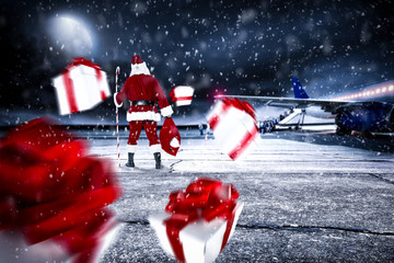 Red old Santa Claus on airport and dark magic night with moon 
