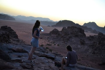 Sunset during Desert tour through sand dunes of Wadi Rum wilderness, Jordan, Middle East, hiking, climbing, driving