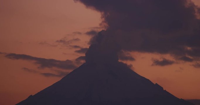 Sunset time of smoke flowing out of Popocatepetl Volcano in Puebla, Mexico. 