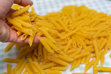 pasta are poured from the hand up the hill next to the table