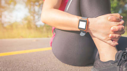 A woman exercises in the morning. To lose weight using Smart Watch is a great help. And effective in calculating the calorie metabolism. Make her shape better, beautiful and more quickly and efficient