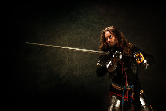 Portrait of a knight armed with a claymore