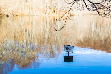 No swimming placard on a dangerous lake