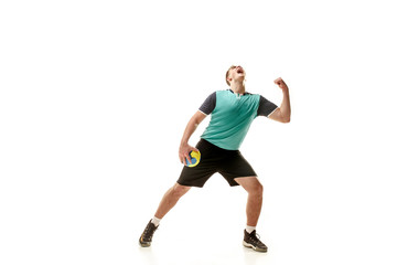 Naklejka na ściany i meble The happy fit caucasian young male handball player at studio on white background. Win, winner, human emotions concept