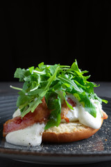 Sandwich with jamon, sauce and arugula