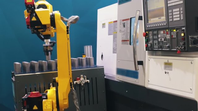 Industrial production. The robot replaces the man in a large production