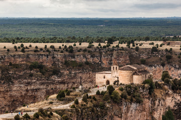 Fototapeta na wymiar Long view of San Frutos hermitage near Duraton Canyon in Segovia. Castilla Leon, Spain