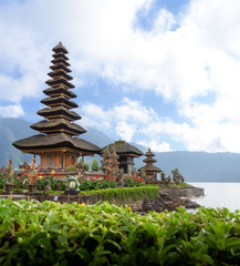 Fototapeta na wymiar Two spires of the floating Pura Bratan hindu temple on Lake Bratan, Bedugul, Bali, Indonesia.