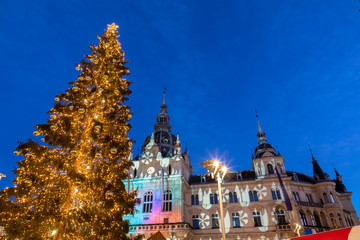 christmas time in graz,the capital of styria,austria. christmassy illuminated townhall on the main square (Hauptplatz) of the city of graz with christmas tree and the memorial for erzherzog johann 