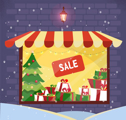 Fototapeta na wymiar Storefront with Christmas gifts sale at snowy evening. Store facade. Lighting shop window with striped canopy in brick wall. Stacks of boxes with bows, xmas tree, sign sale.Flat cartoon vector