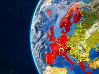 Western Europe from space on model of planet Earth with country borders and very detailed planet surface and clouds.