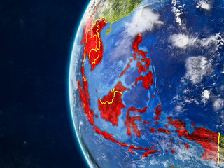 South East Asia from space on model of planet Earth with country borders and very detailed planet surface and clouds.