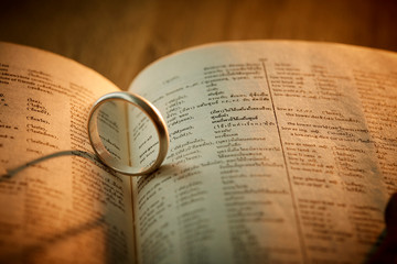 Silver ring on pages book