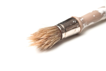 closeup of paint brush on white background