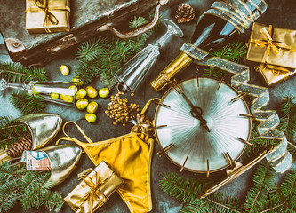 LATIN AMERICAN AND SPANISH NEW YEAR TRADITIONS. empty suitcase, lentil spoon, yellow interior clothes, gold ring in champagne, 12 grapes, money in shoe - ARGENTINE MONEY.