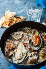 Mussels with Blue Cheese Sauce and Garlic Baguette.