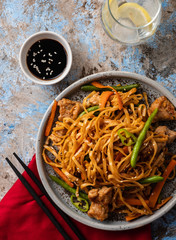 Asian noodles with pork in teriyaki sauce, with green beans, carrots and shiitake mushrooms.