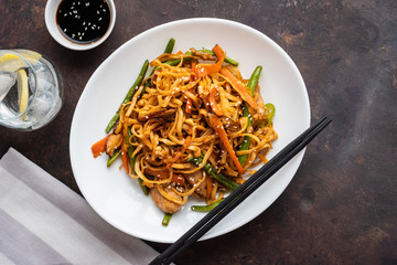Asian noodles with pork in teriyaki sauce, with green beans, carrots and shiitake mushrooms.