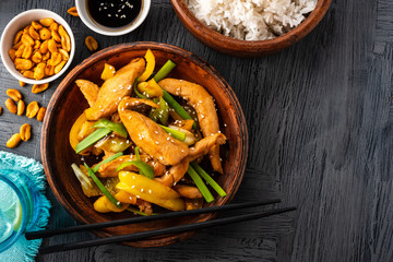 Kung Pao chicken, stir-fried Chinese sichuan traditional sichuan  dish with chicken, peanuts, vegetables and chili peppers.