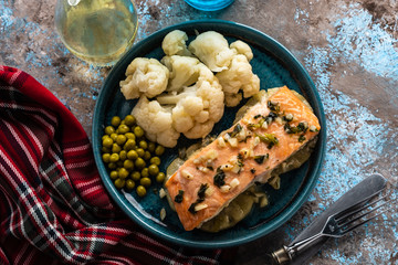 Solomon fillet with pineapple and cauliflower. Fish with vegetables.