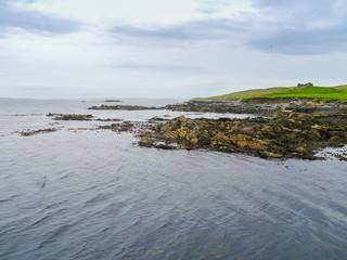 landscape with shoreline and abandoned ruins of a croft in shetland © Elisabeth 