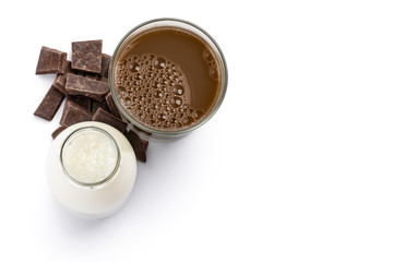 chocolate glass and milk bottle with chocolate blocks on white background