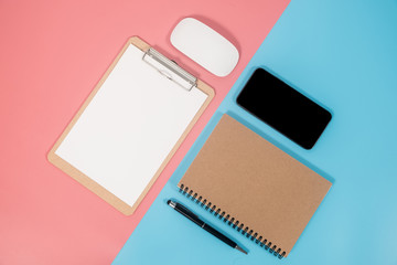 Smartphone and office accessories on colorful background with copy space. Flat lay modern and minimal style.