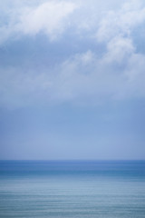Naklejka na ściany i meble Blue sea in a blue background