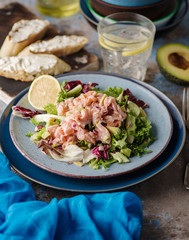 Ceviche is a traditional dish from Peru. Salmon marinated in lemon with fresh lettuce, avocado and onions