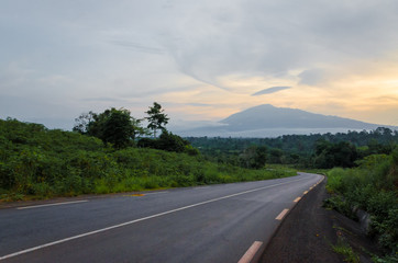 Scenic view of Mount Cameroon mountain with green forest during sunset, highest mountain in West...
