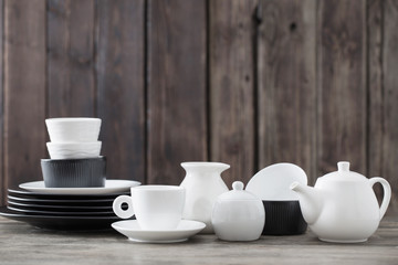 dinnerware on wooden background in kitchen