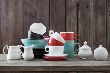 dinnerware on wooden background in kitchen