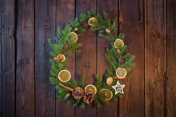 Christmas wreath on old wooden background