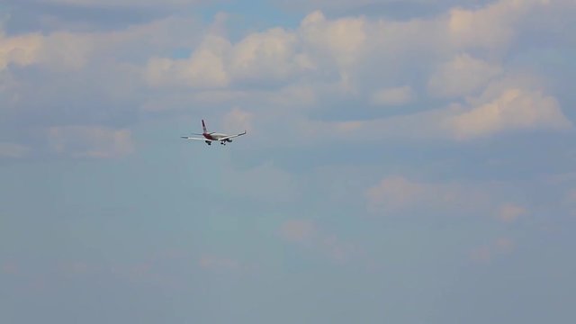 flight of the plane in the clouds and over the fields