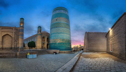 Khiva, Uzbekistan. Panoramic cityscape with Kalta Minor minaret at dusk (HDR - image)