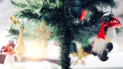 Christmas Ornament With gold Snowflakes, under pine tree, Merry Christmas and Happy New Year