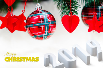 Shiny red christmas balls, heart and stars on white with pine tree for new year with 2019 text