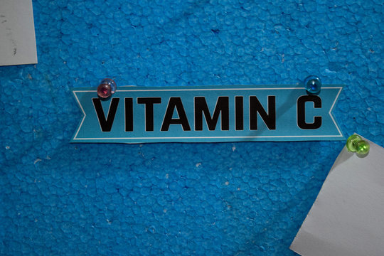 Vitamin C text on the paper is attached to the styrofoam with push pins, Health care concept as a schedule reminders