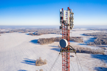 Telecommunications tower with antennas, aerial view.