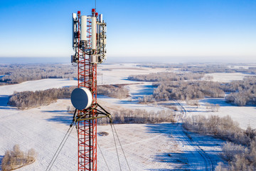 Telecommunications tower with antennas, aerial view.