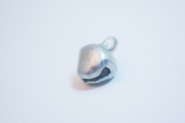 Obraz na płótnie Canvas small metallic bell on a white background