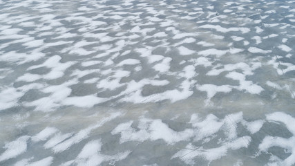 Ice, snow and cracks on the surface of sea 