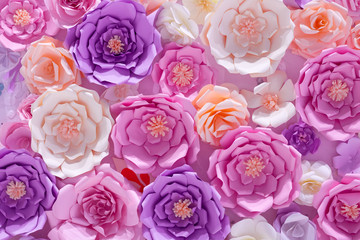 Multicolored pink purple wedding floral background pattern of paper flowers