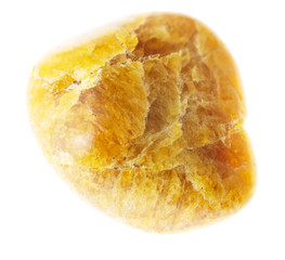 tumbled clinogumite (clinohumite) gem on white